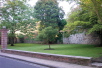 A peaceful green area with a fine close cropped lawn.