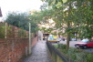 Just before you reach the Wessex Hotel, turn left and follow the path across Market Lane and the remains of St Maurice Church.