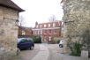 A view across the courtyard of the Historic Resources Center, looking toward Hyde Abbey House.