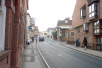 Further up may be seen parts of the Winchester Brewery, which has recently been redeveloped. On your left is the White Swan, an old coaching house, opposite the Baptist Church.